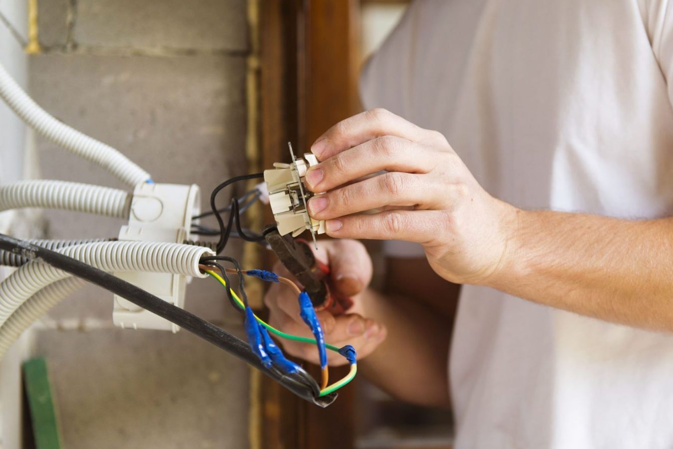 Electrician inspecting electrical panel